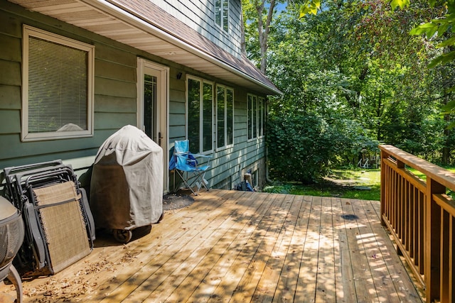 wooden deck with a grill