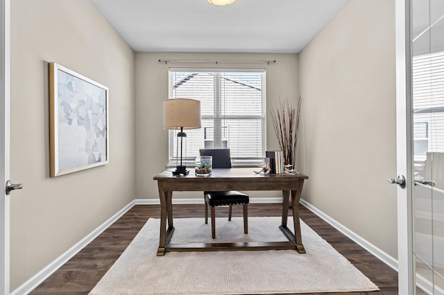 home office featuring dark wood finished floors and baseboards