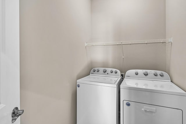 clothes washing area with laundry area and washing machine and dryer