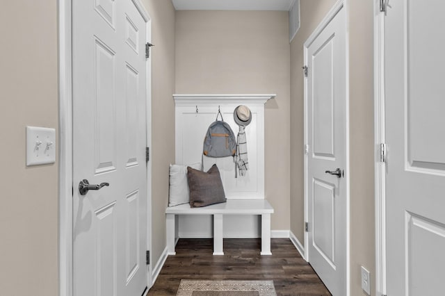 mudroom with dark wood-style floors, visible vents, and baseboards