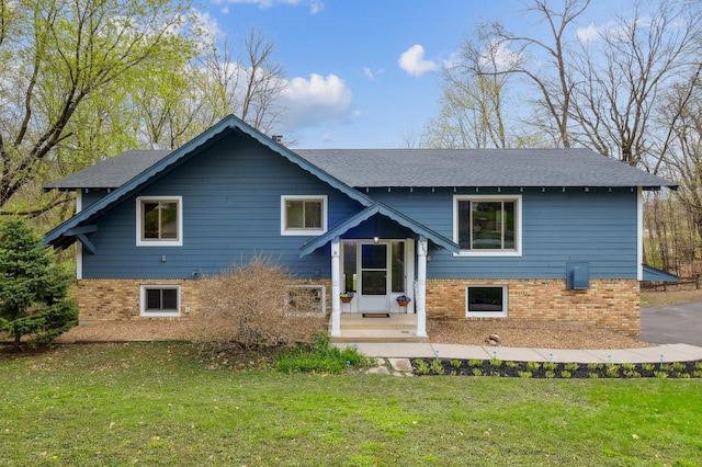 5745 Echo Rd, Excelsior, MN 55331 - bi-level home featuring brick siding, a shingled roof, and a front lawn