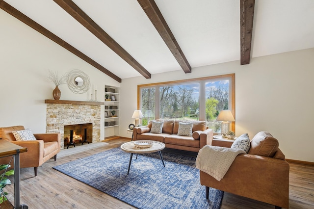 5745 Echo Rd, Excelsior, MN 55331 - living room with a fireplace, built in shelves, baseboards, vaulted ceiling with beams, and wood finished floors