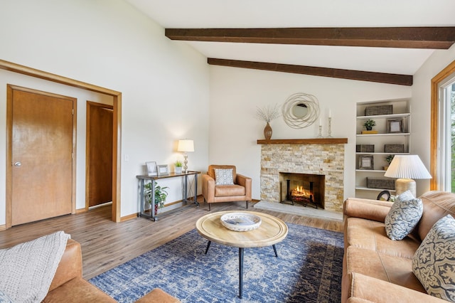 5745 Echo Rd, Excelsior, MN 55331 - living room with a stone fireplace, baseboards, wood finished floors, and vaulted ceiling with beams