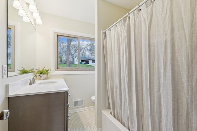 5745 Echo Rd, Excelsior, MN 55331 - bathroom featuring visible vents, vanity, tile patterned floors, baseboards, and toilet