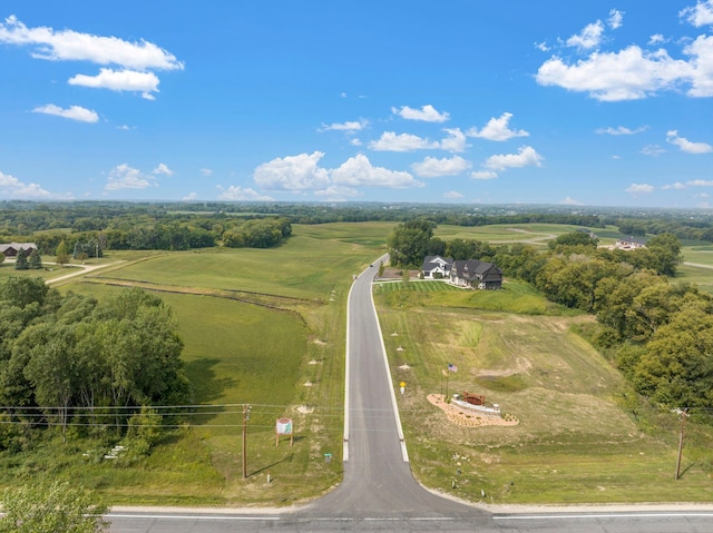 birds eye view of property with a rural view