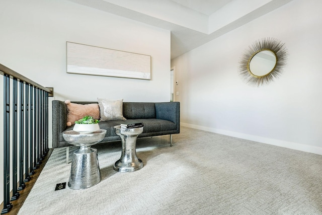 sitting room with carpet floors and baseboards