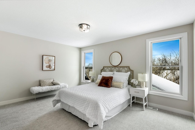 bedroom with carpet flooring and baseboards