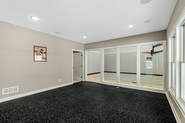 unfurnished bedroom featuring recessed lighting, visible vents, and baseboards