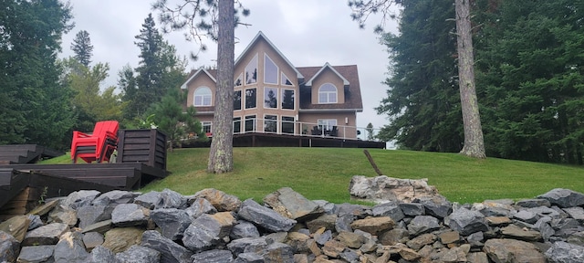 rear view of house with a lawn