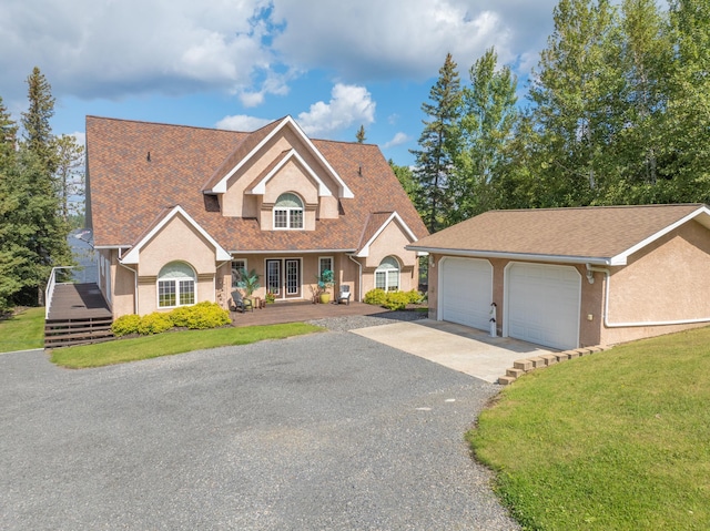 view of front of property featuring a front yard and a garage