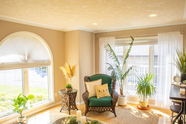 living area featuring crown molding, a textured ceiling, and hardwood / wood-style flooring