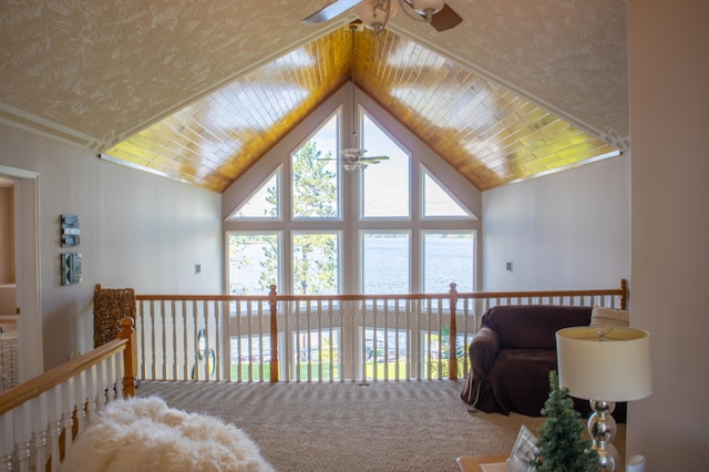 bedroom with carpet, ceiling fan, and vaulted ceiling