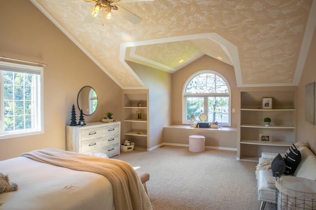 carpeted bedroom featuring ceiling fan and vaulted ceiling