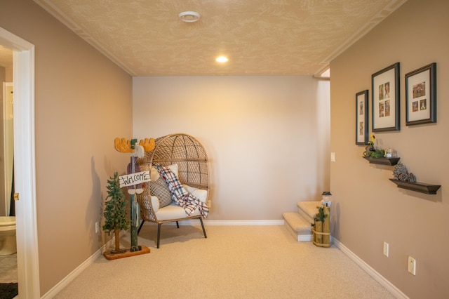 living area with a textured ceiling and carpet flooring