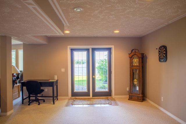 entryway featuring a textured ceiling and carpet flooring