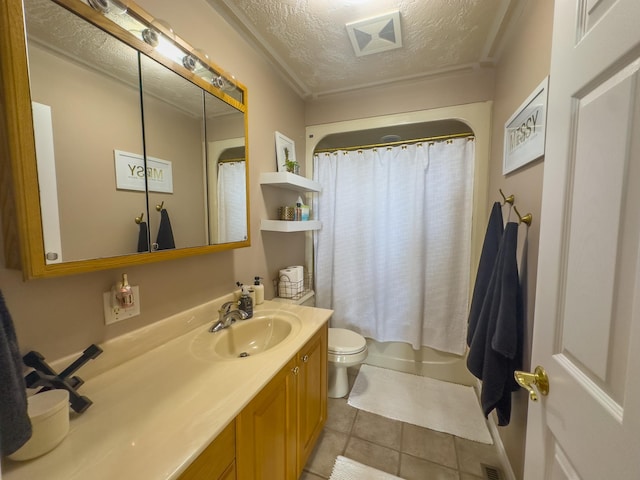 full bathroom featuring toilet, tile patterned floors, vanity, a textured ceiling, and shower / bath combo with shower curtain