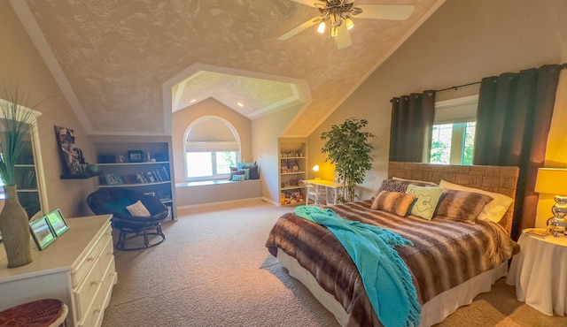 carpeted bedroom featuring lofted ceiling and ceiling fan