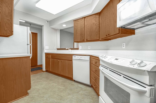 kitchen featuring light tile patterned floors and white appliances