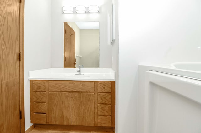 bathroom with tile patterned flooring and vanity