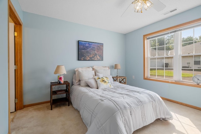 carpeted bedroom with ceiling fan