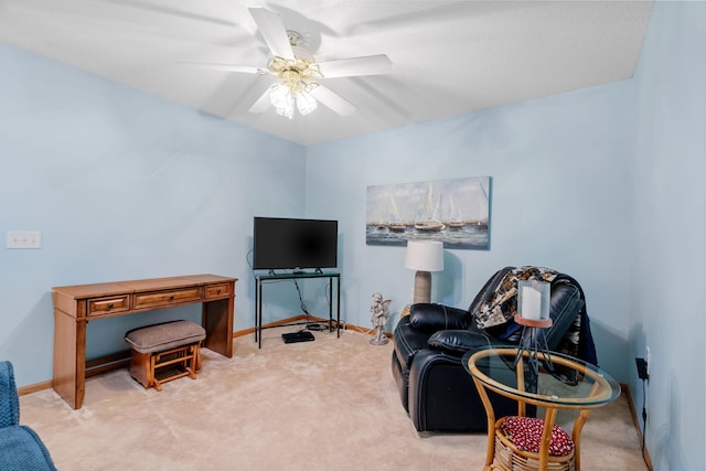 sitting room featuring ceiling fan and light colored carpet