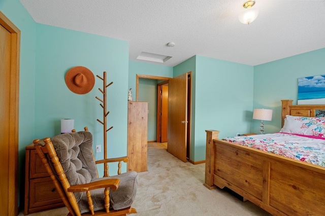 carpeted bedroom featuring a textured ceiling