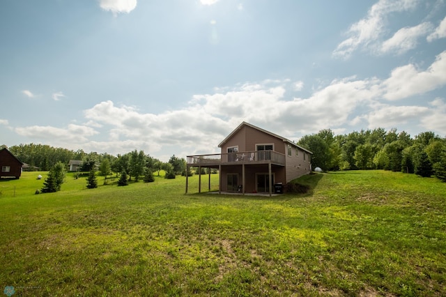 view of yard featuring a wooden deck