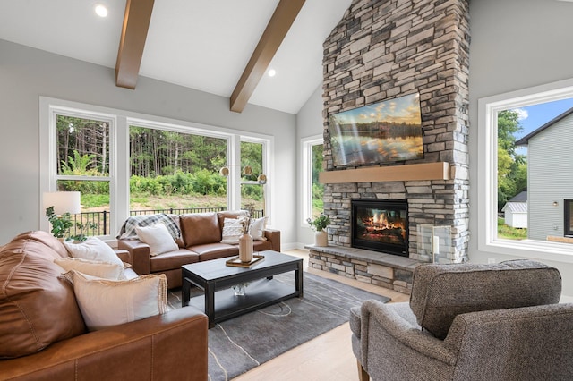 living room with beam ceiling, wood-type flooring, high vaulted ceiling, and a fireplace