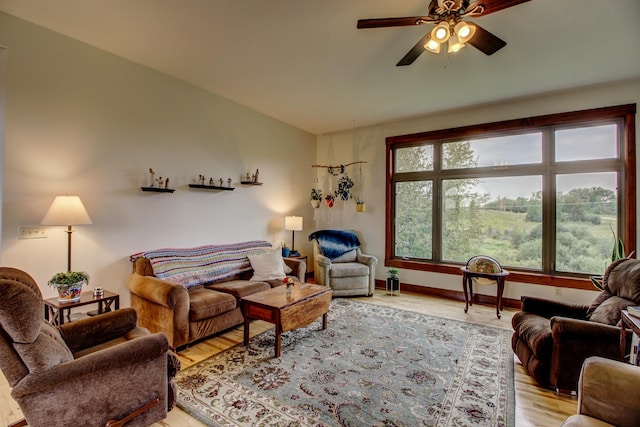 living room featuring light hardwood / wood-style floors and ceiling fan