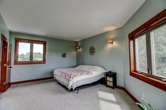 bedroom with carpet and baseboards