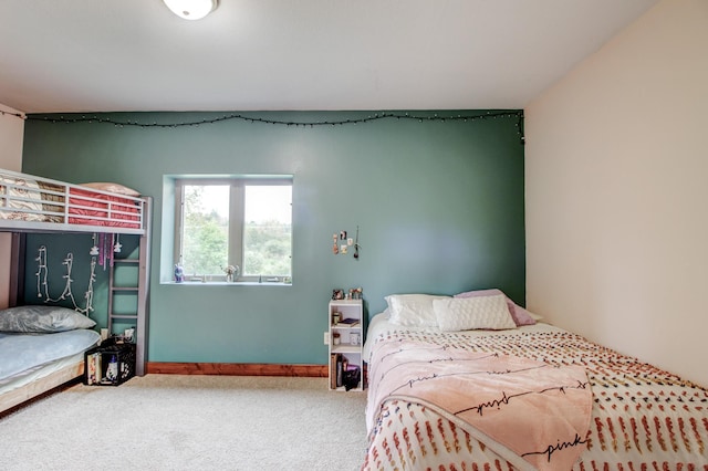 bedroom featuring carpet flooring and baseboards