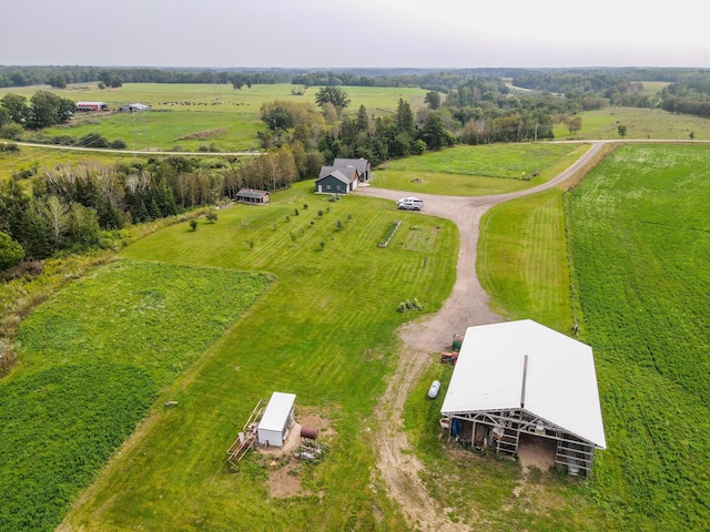 birds eye view of property with a rural view