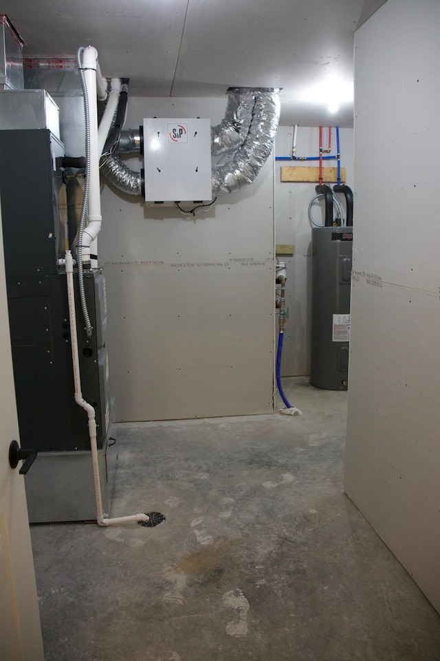 utility room featuring water heater