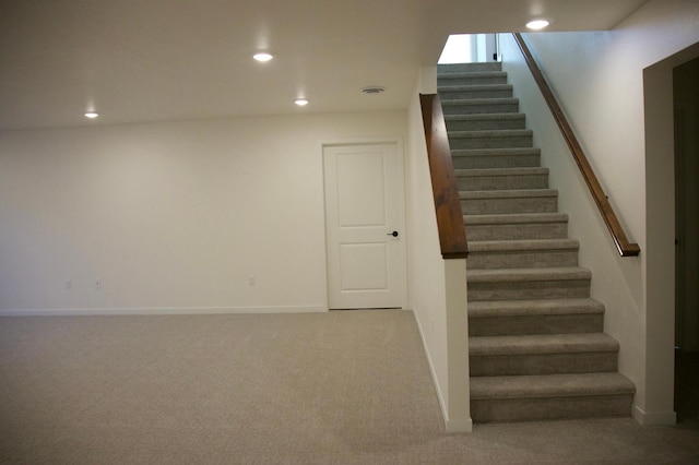 stairway with visible vents, recessed lighting, baseboards, and carpet floors