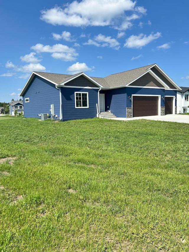 ranch-style house with a front lawn and a garage