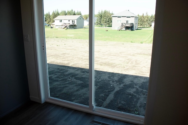 doorway to outside featuring hardwood / wood-style flooring