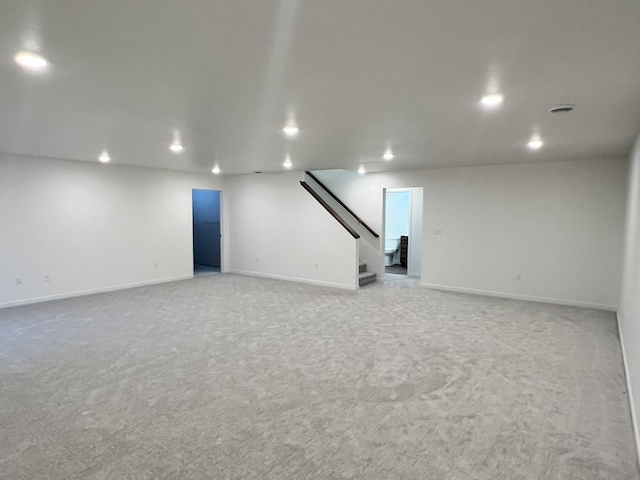 interior space featuring light carpet