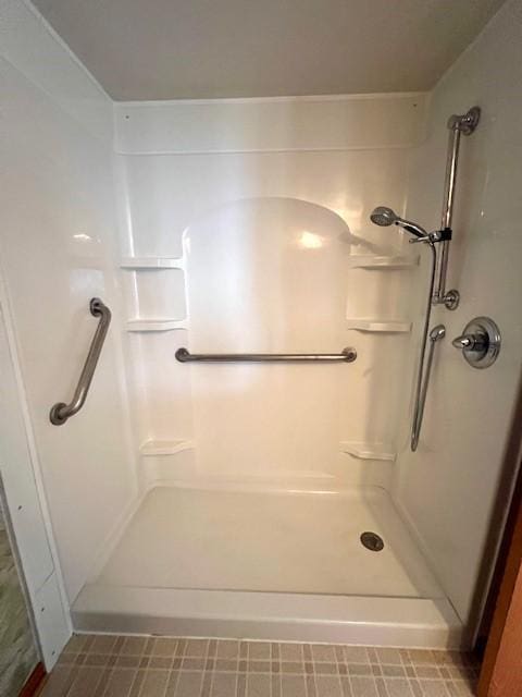 bathroom featuring a shower and tile patterned floors