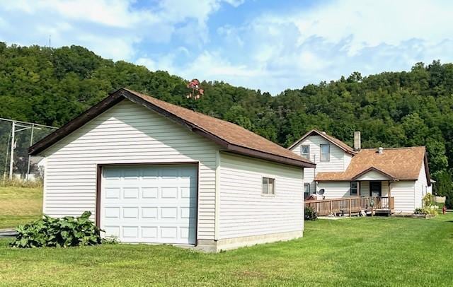 garage featuring a lawn