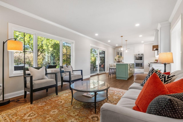 living room featuring light hardwood / wood-style flooring and ornamental molding