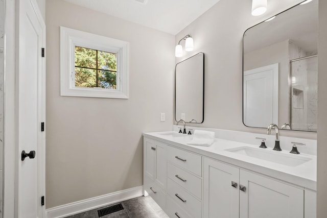 bathroom with vanity and tile patterned floors