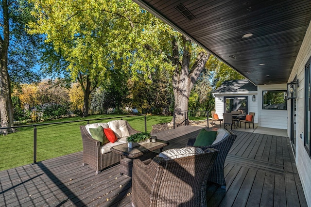 deck featuring an outdoor living space and a lawn