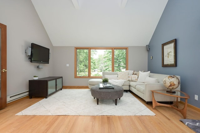 living room featuring a baseboard heating unit, lofted ceiling, light wood-style floors, and baseboards