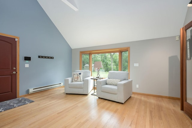 living area featuring light wood finished floors, baseboards, baseboard heating, and high vaulted ceiling