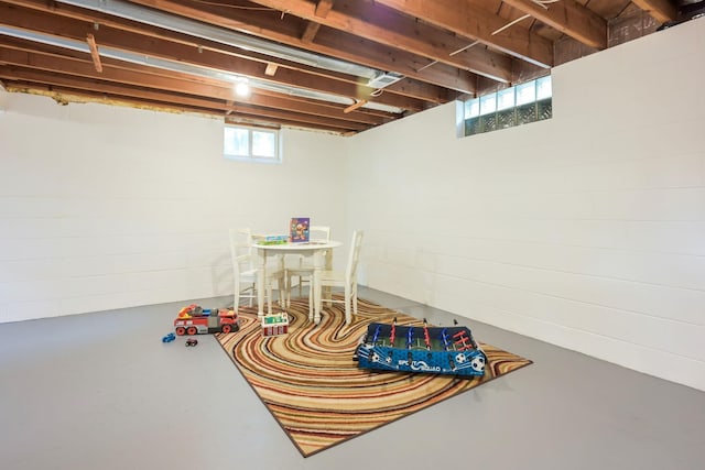 rec room featuring finished concrete floors