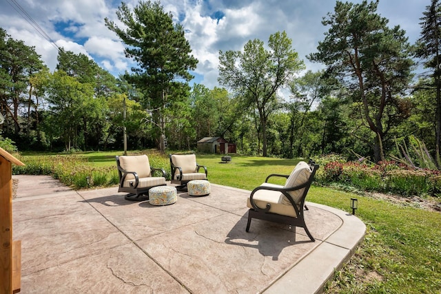 view of patio featuring an outdoor structure and a shed