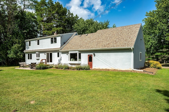 back of property featuring a shingled roof, an outdoor hangout area, a yard, and stucco siding