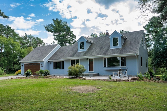 cape cod-style house featuring a front yard, roof with shingles, a chimney, a garage, and driveway