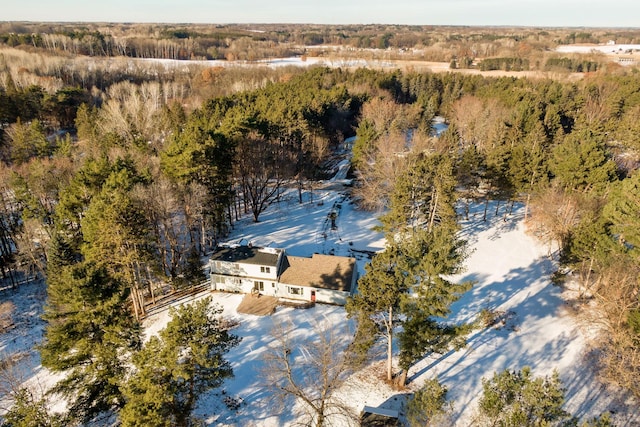 birds eye view of property with a view of trees