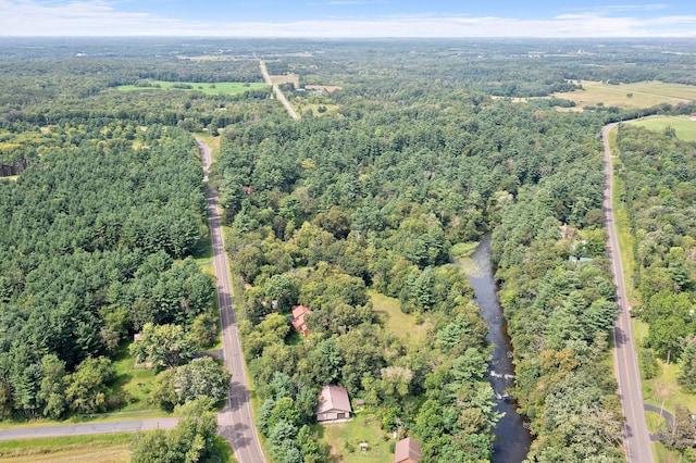 aerial view featuring a wooded view